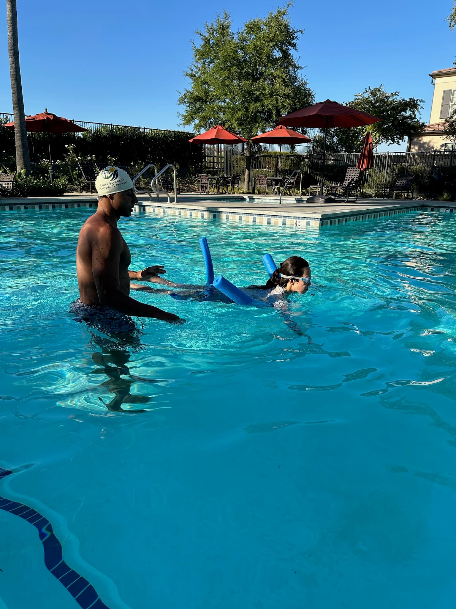 Student practicing with a pool noodle